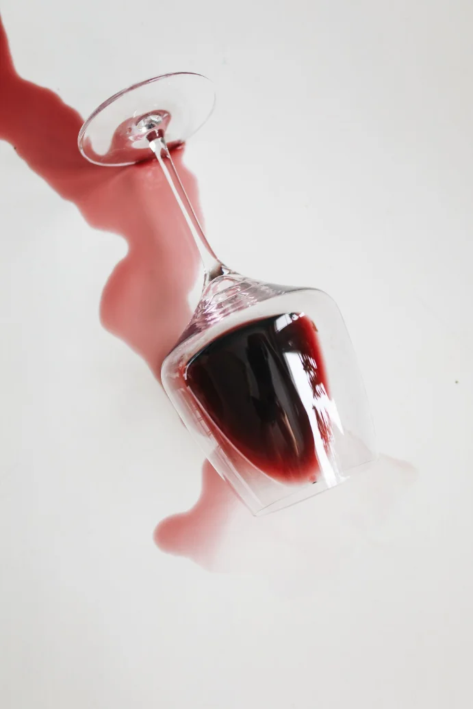 Red wine spill on a light-coloured carpet