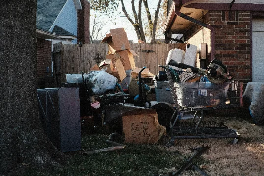 Skip bin loaded with household rubbish for removal