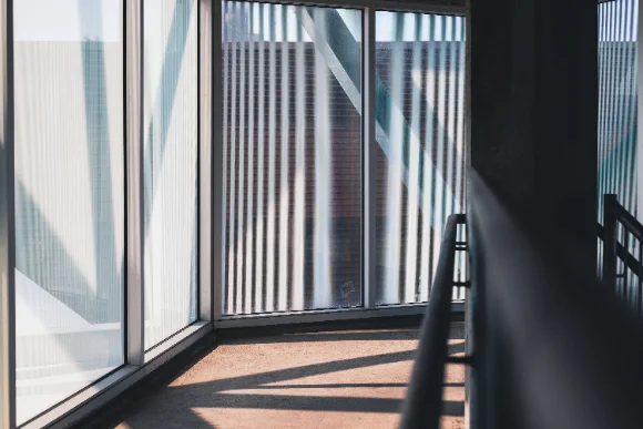 Commercial glazing being cleaned from an elevated platform
